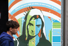 The image shows a mural of Sinead O'Connor, with the words "Sinead you were right all along. We were wrong. So sorry." 