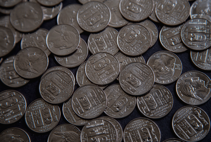 The photo shows a pile of Pauli Murray quarters 