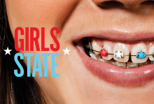 The image shows a close up image of a girl smiling, she has braces that are red white and blue. There is text that reads "Girls State" 