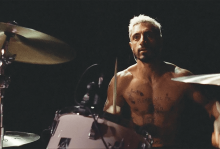 A drummer sits at his drum set in a scene from 'Sound of Metal'